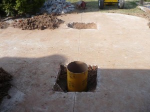 foundation hole with empty sonotube in place