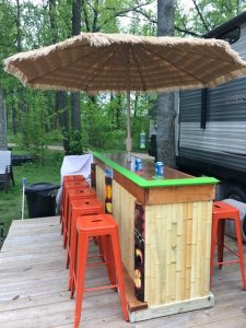 outdoor tiki bar with umbrella