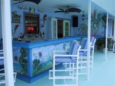 blue tropical backyard bar under patio roof