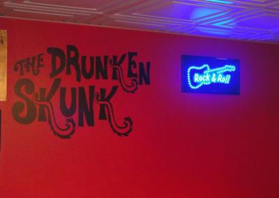 the drunken skunk speakeasy logo